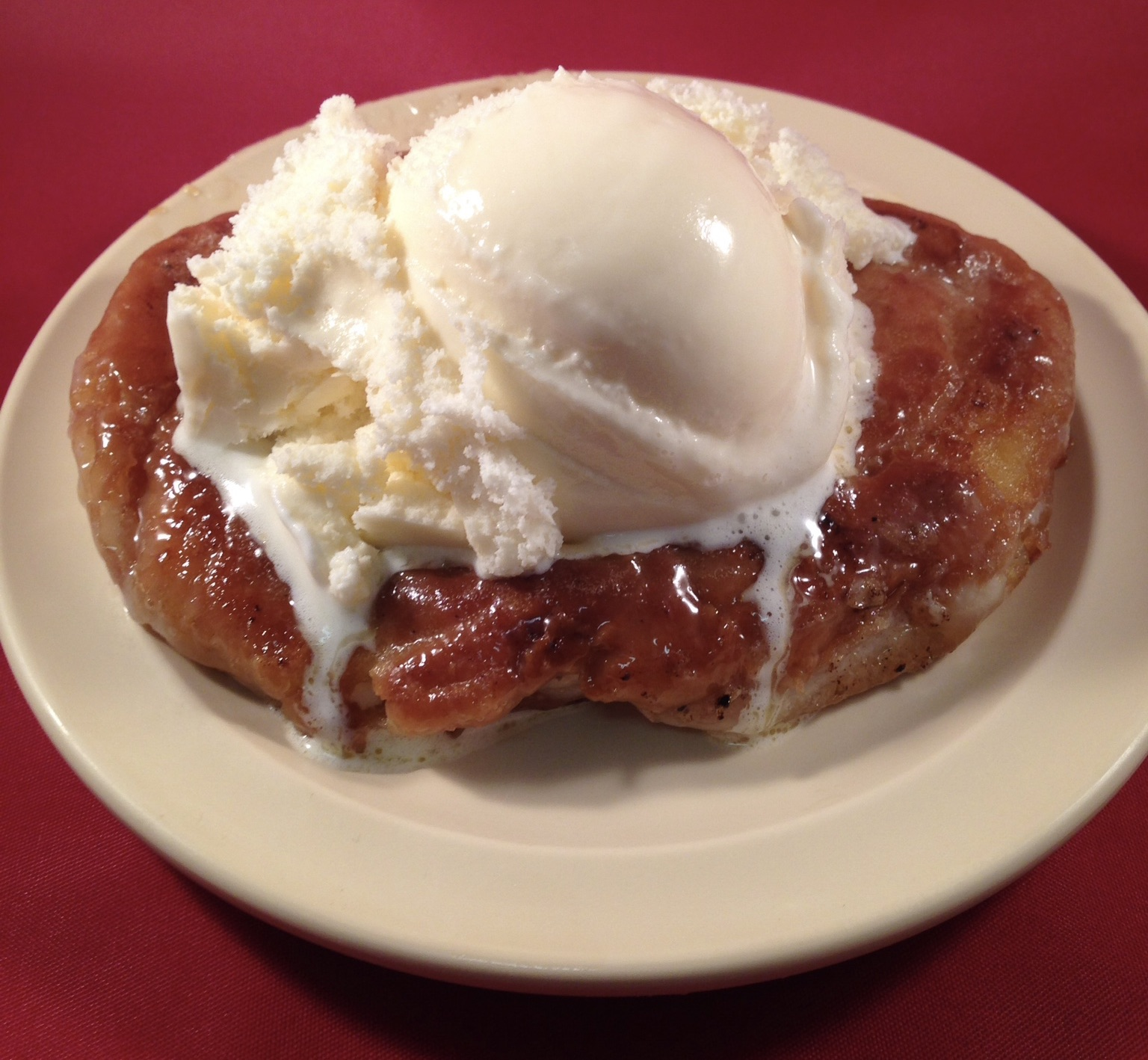 Warm honeybun topped with ice cream