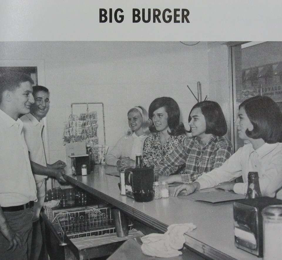 Vintage photo of customers at Johnny's Big Burger counter