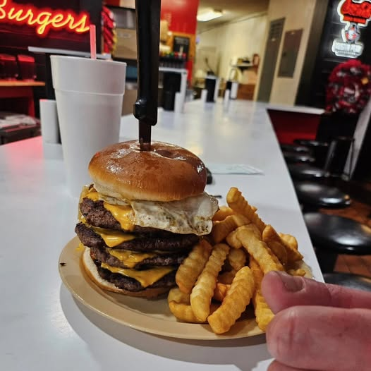 Fresh-ground burger with fried egg and crinkle fries